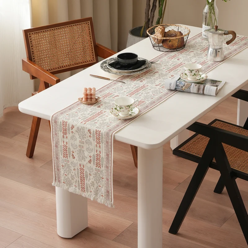 Woven jacquard table runner with floral medallion and fringes Stornfield