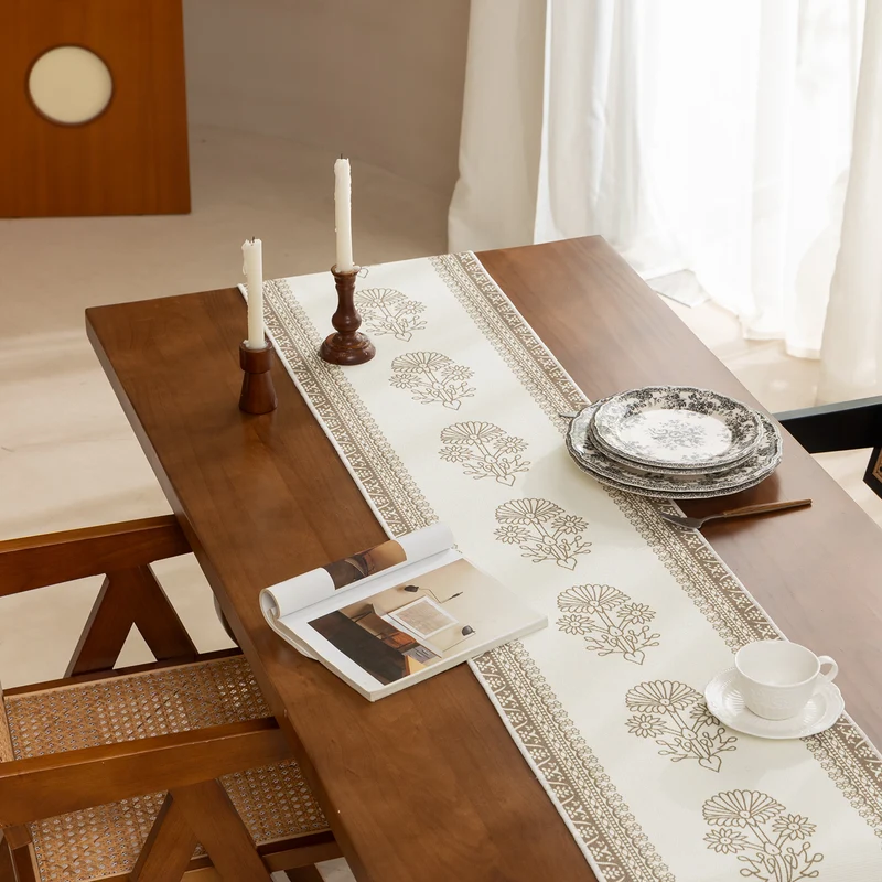 Woven decorative table runner with floral medallion borders and fringes Stornfield