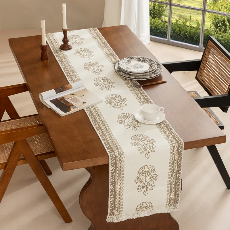 Woven decorative table runner with floral medallion borders and fringes Stornfield