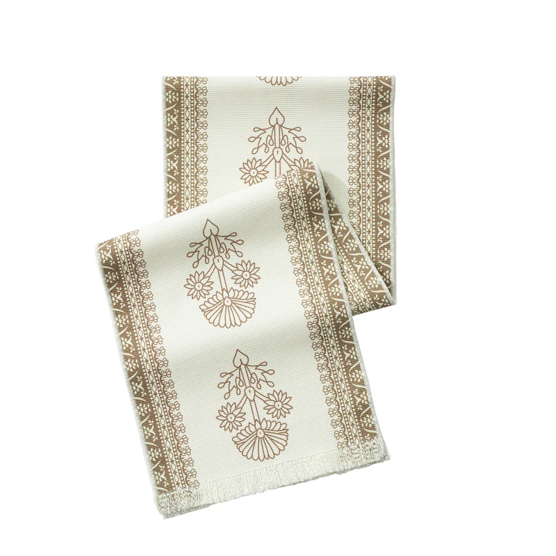 Woven decorative table runner with floral medallion borders and fringes Stornfield