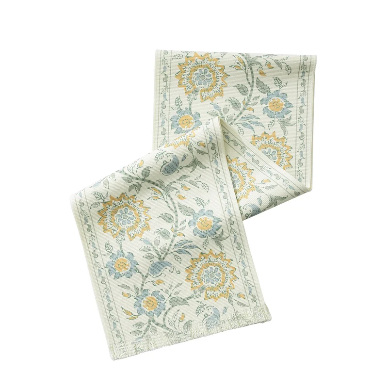 Woven decorative table runner with floral medallion borders and fringes Stornfield