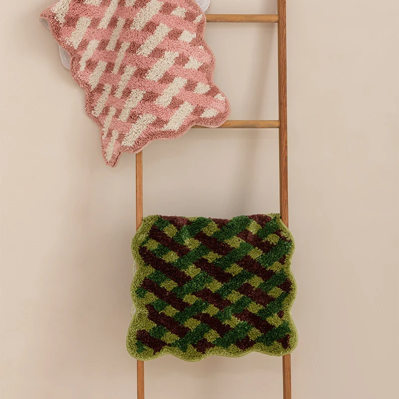 Tufted bathroom runner with wavy hem and relief-style braided pattern Stornfield