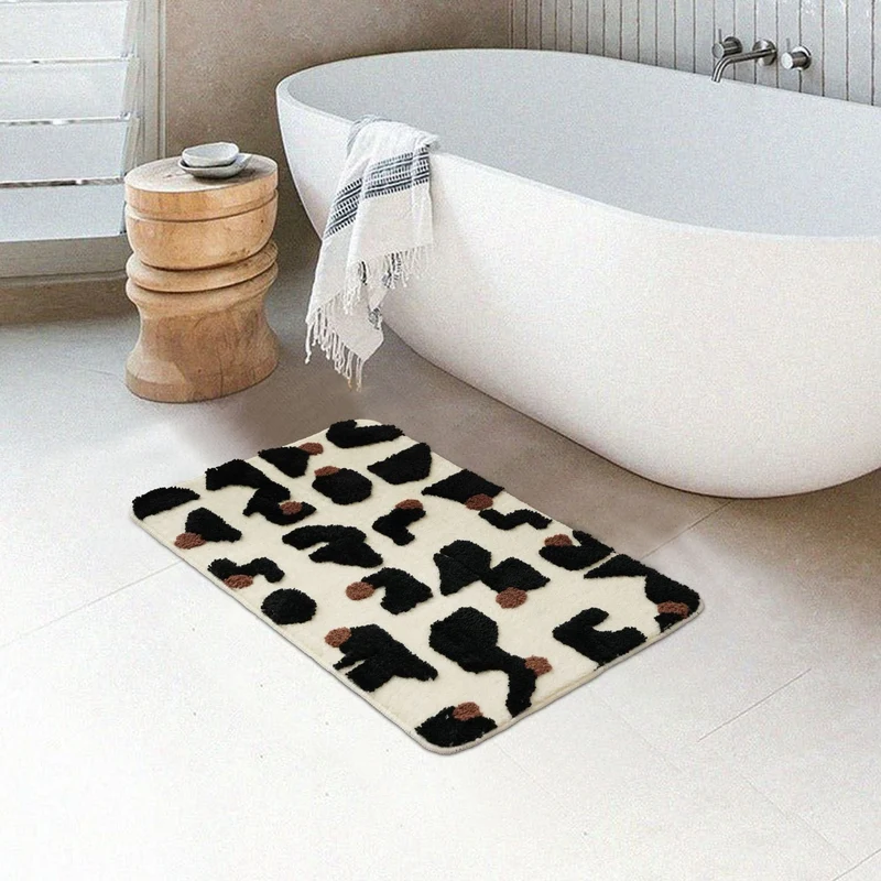Tufted bathroom mat in abstract leopard pattern with soft high pile Stornfield