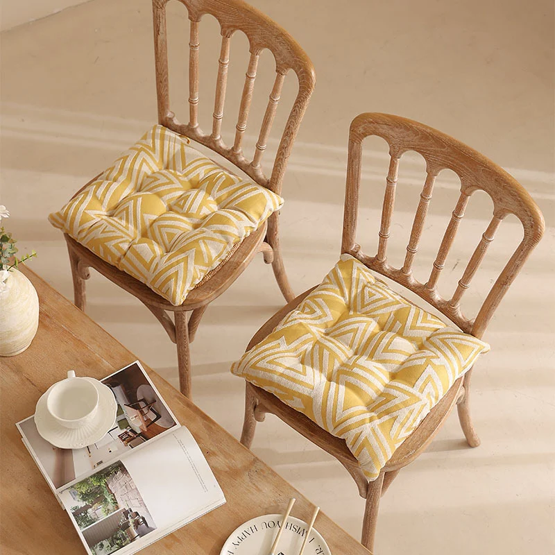 Padded quilted seat cushion with colorful button applications and non-slip underside Stornfield