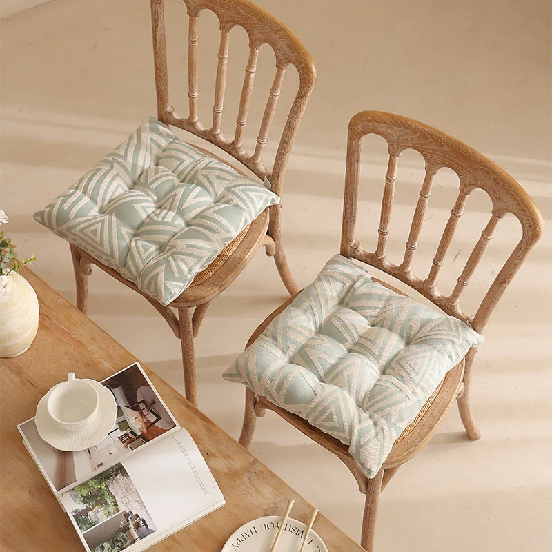 Padded quilted seat cushion with colorful button applications and non-slip underside Stornfield