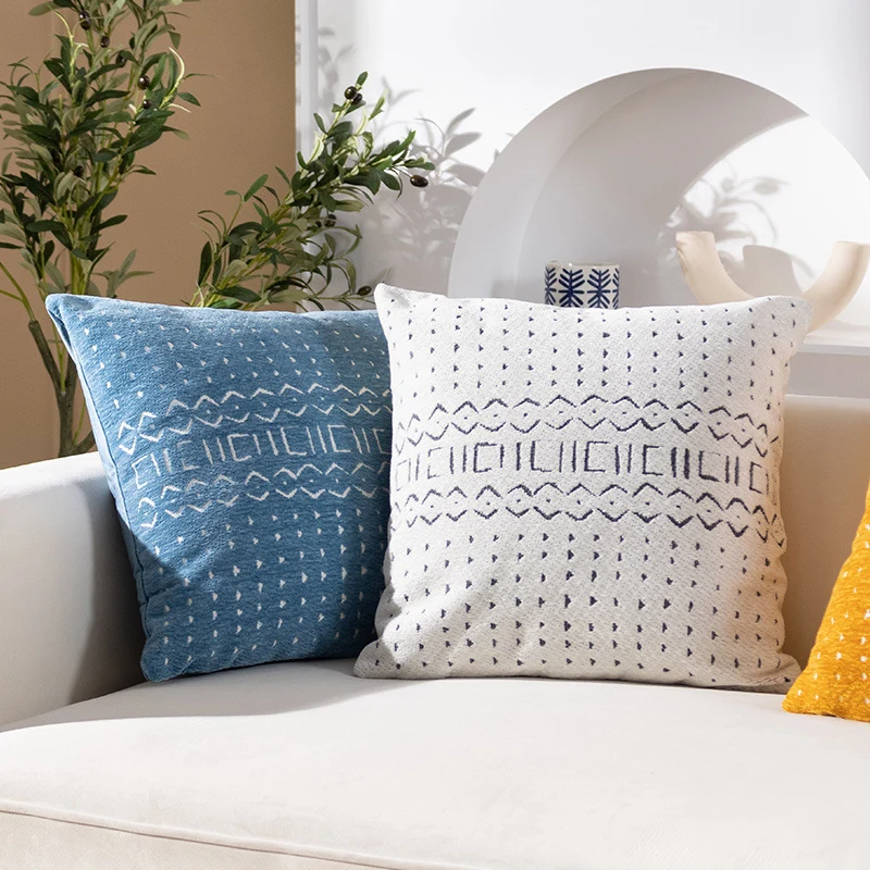 Woven pillow cover with geometric ethnic relief and textured tufting look Stornfield