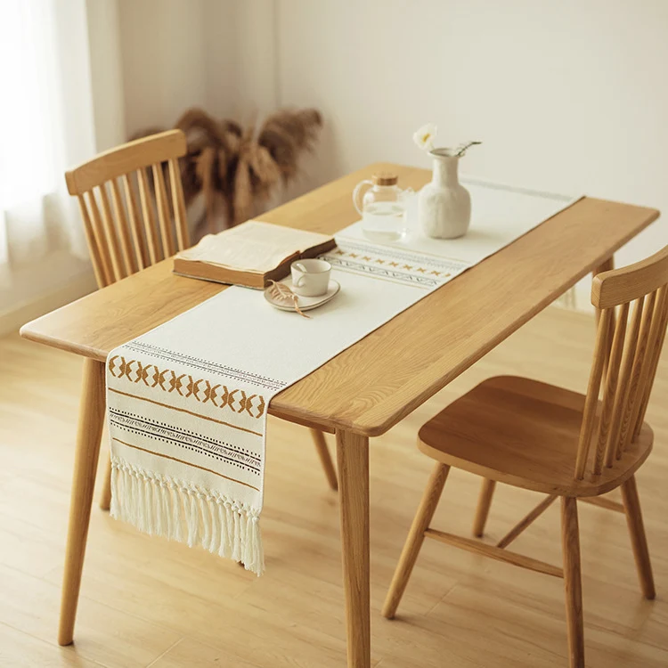 Woven Boho table runner made of cotton blend with decorative fringes and graphic stripe pattern Stornfield