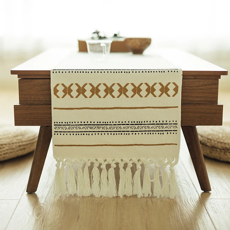 Woven Boho table runner made of cotton blend with decorative fringes and graphic stripe pattern Stornfield
