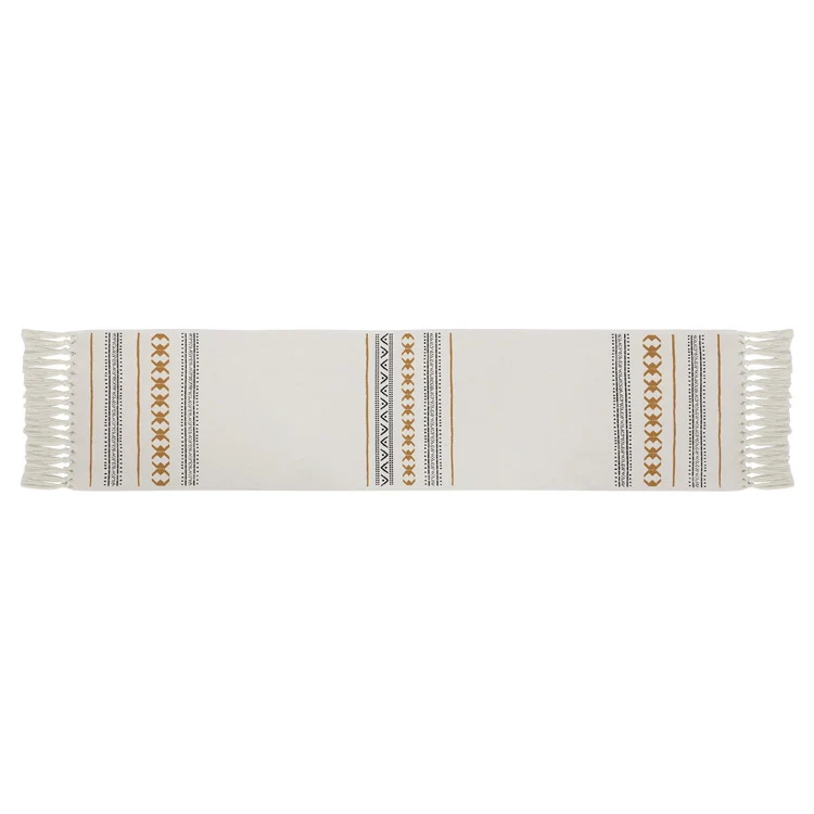 Woven Boho table runner made of cotton blend with decorative fringes and graphic stripe pattern Stornfield