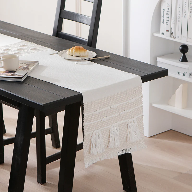 Woven cotton table runner with boho stripes, fringes, and textured woven edge Stornfield