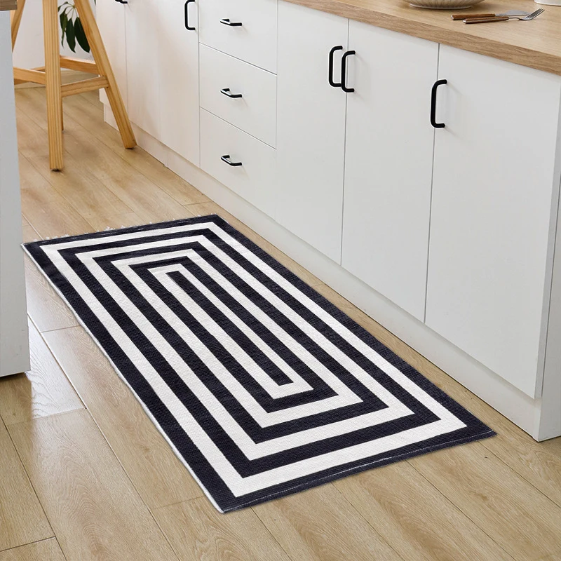 Woven cotton blend bath mat in buffalo check with flat weave structure Stornfield
