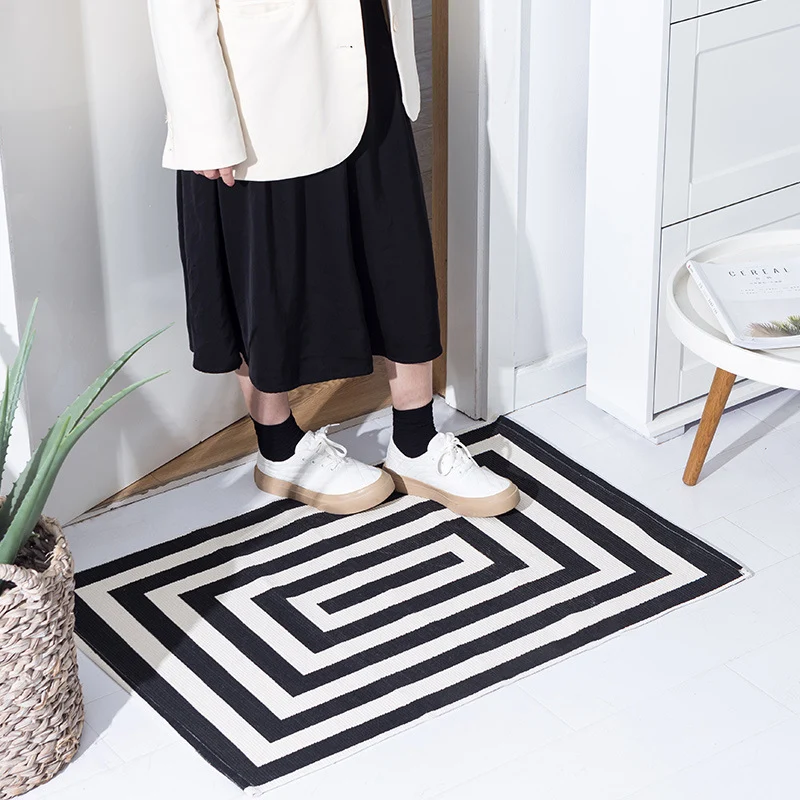Woven cotton blend bath mat in buffalo check with flat weave structure Stornfield