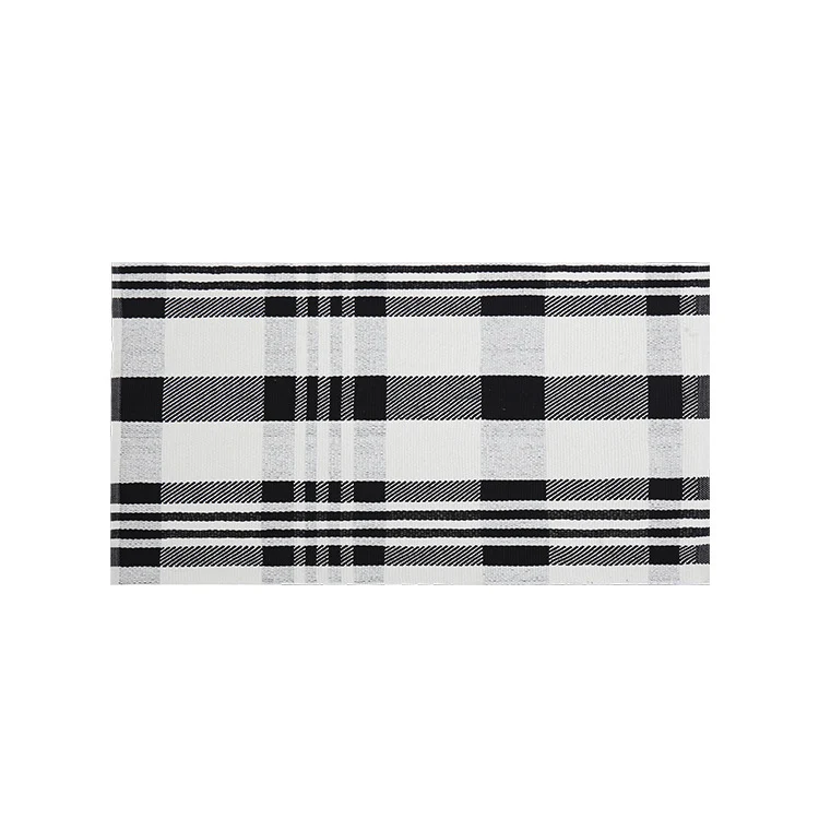 Woven cotton blend bath mat in buffalo check with flat weave structure Stornfield
