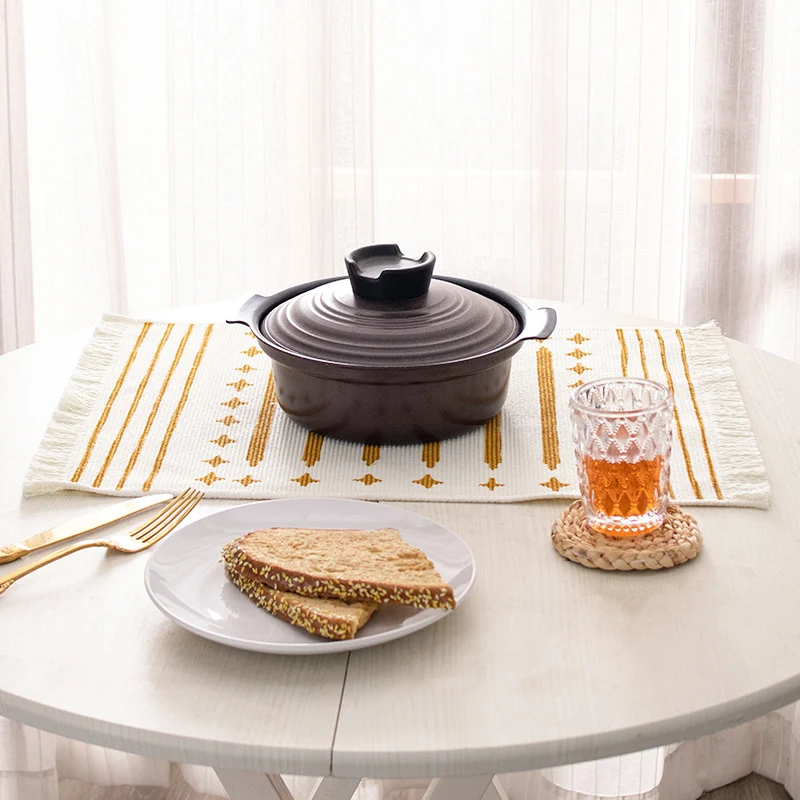 Woven placemat made of cotton blend with geometric diamond trim and fine texture Stornfield