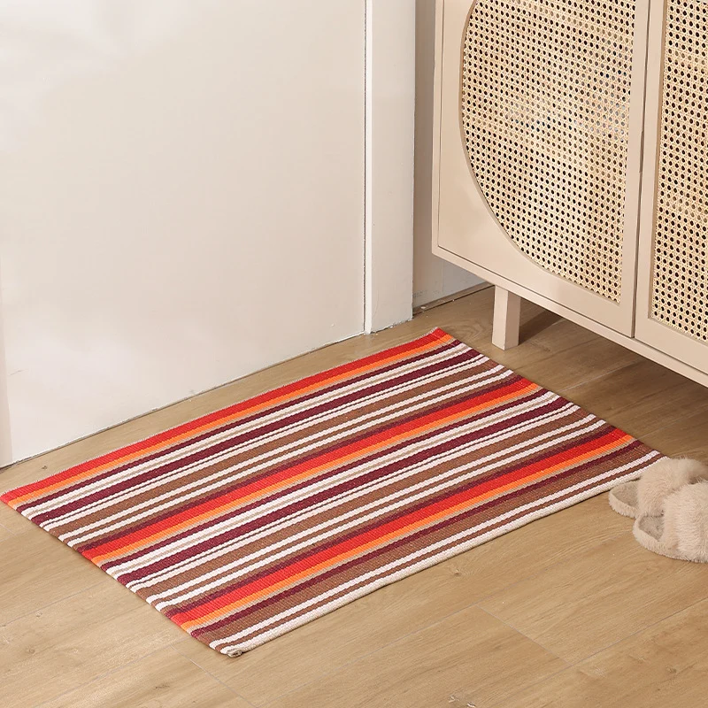 Striped cotton doormat with non-slip bottom and decorative woven edge Stornfield