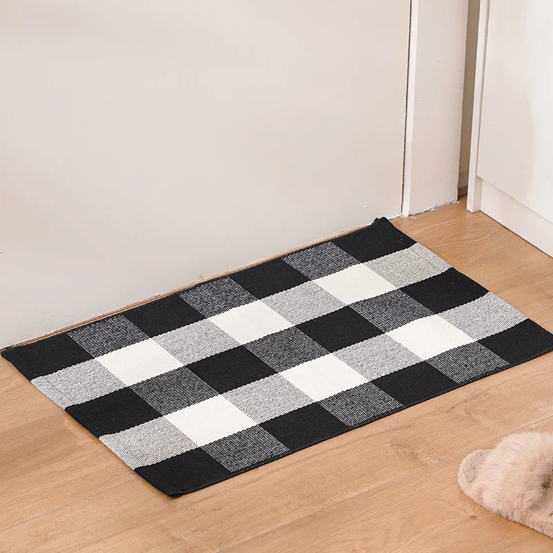 Striped cotton doormat with non-slip bottom and decorative woven edge Stornfield