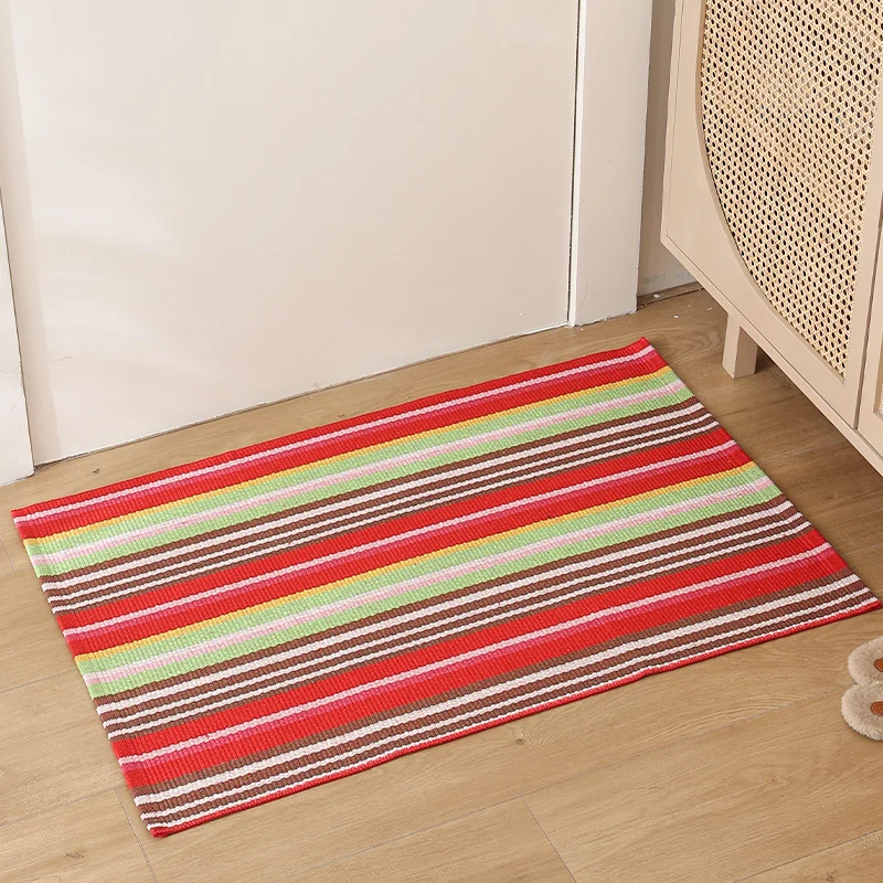 Striped cotton doormat with non-slip bottom and decorative woven edge Stornfield