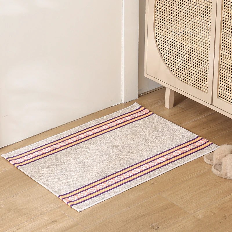 Striped cotton doormat with non-slip bottom and decorative woven edge Stornfield