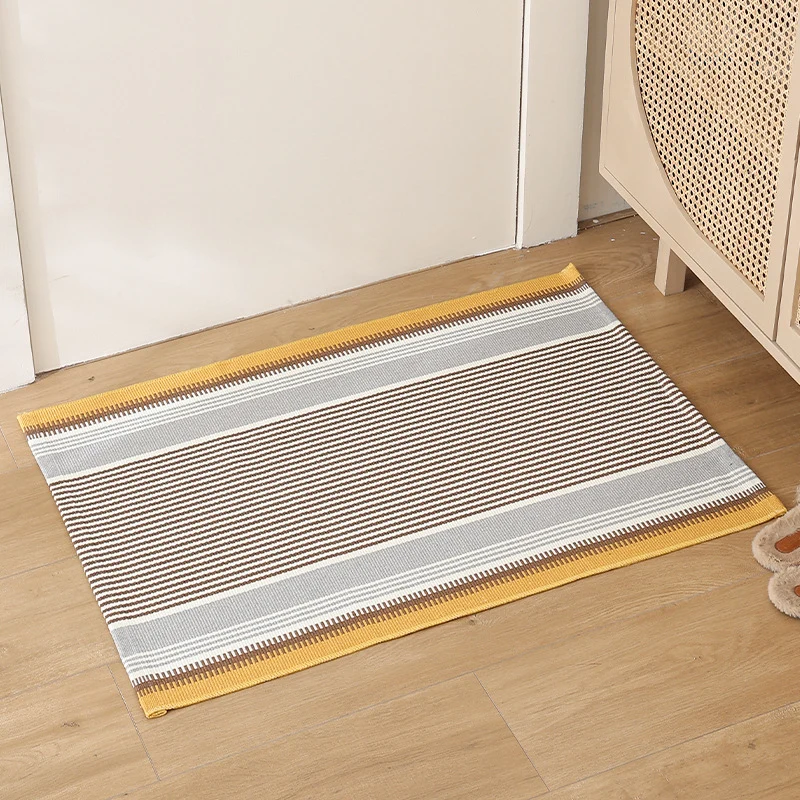 Striped cotton doormat with non-slip bottom and decorative woven edge Stornfield