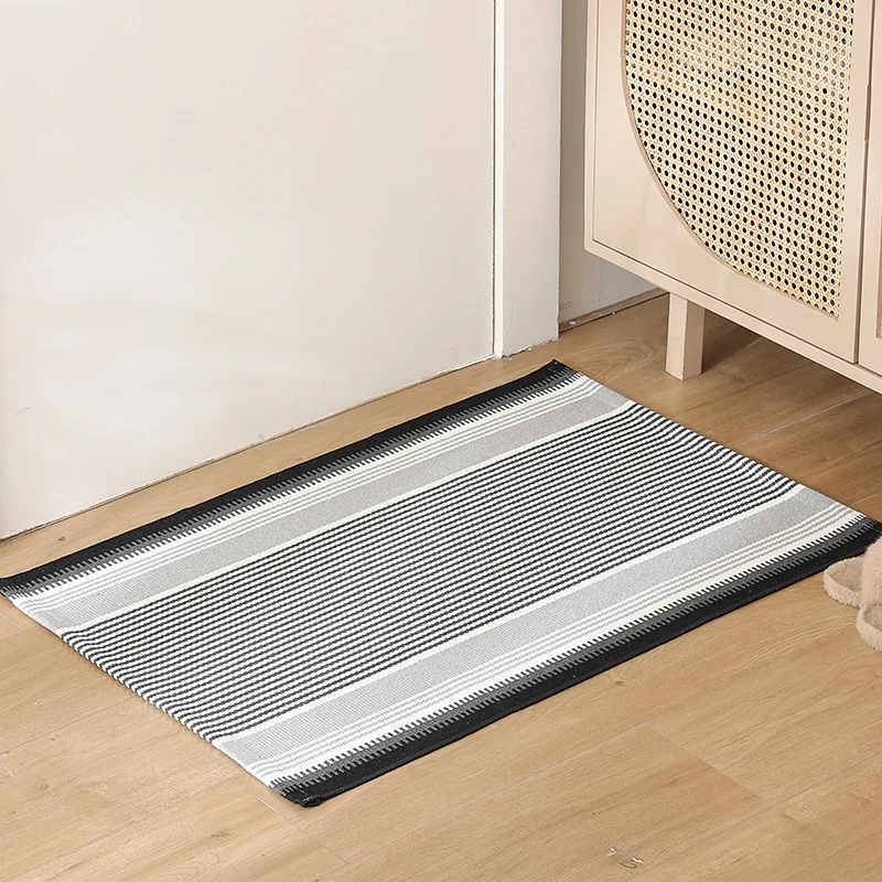 Striped cotton doormat with non-slip bottom and decorative woven edge Stornfield