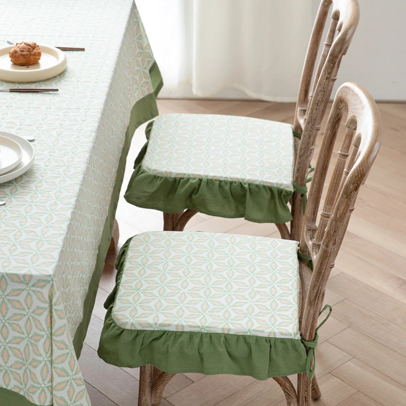 Padded chair cushion with ties, ruffled edge and embroidered hole pattern look Stornfield