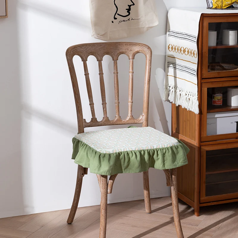 Padded chair cushion with ties, ruffled edge and embroidered hole pattern look Stornfield