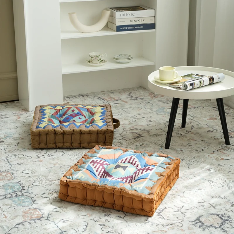 Padded seat and floor cushion with carrying handle and graphic ethno pattern Stornfield
