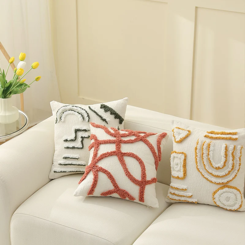 Geometric tufted sofa cushion with textured loop appliqué and removable cover Stornfield