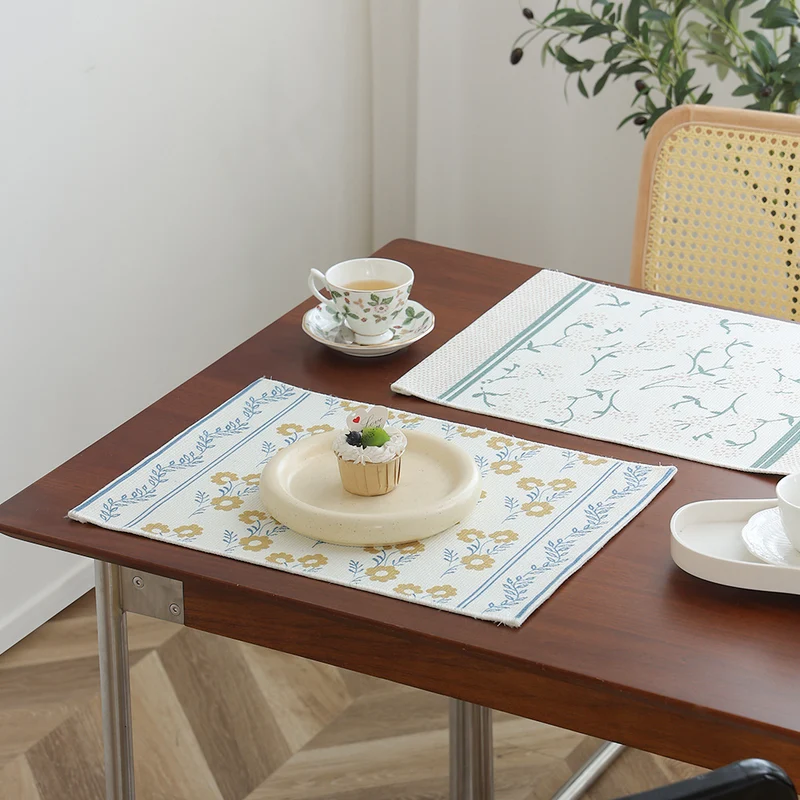 Floral woven bath mat with jacquard structure, absorbent cotton surface and non-slip underside Stornfield