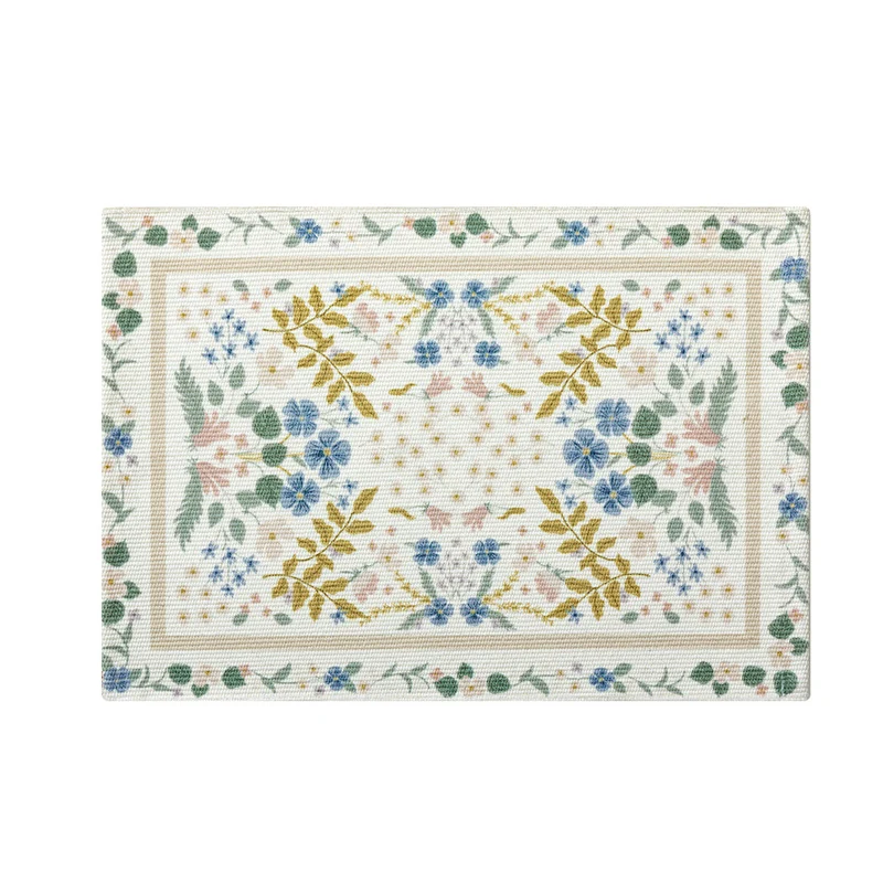 Floral woven bath mat with jacquard structure, absorbent cotton surface and non-slip underside Stornfield