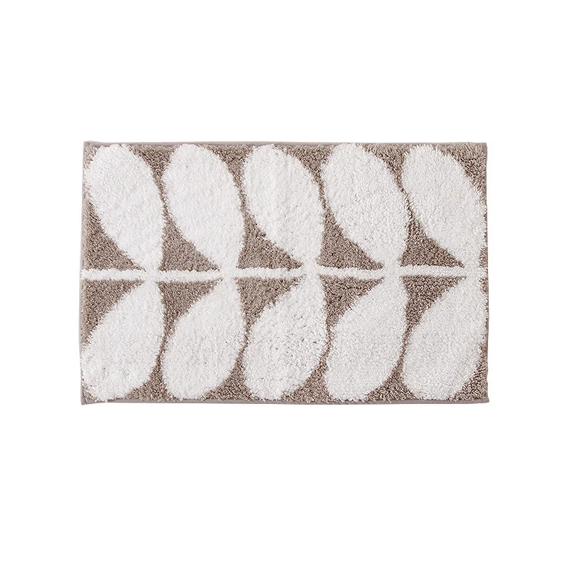 Fluffy bath mat in a graphic wave relief with anti-slip base Stornfield