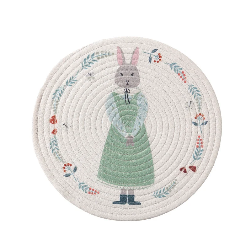 Round placemat made of woven cotton with a cute rhinoceros illustration and floral wreath Stornfield
