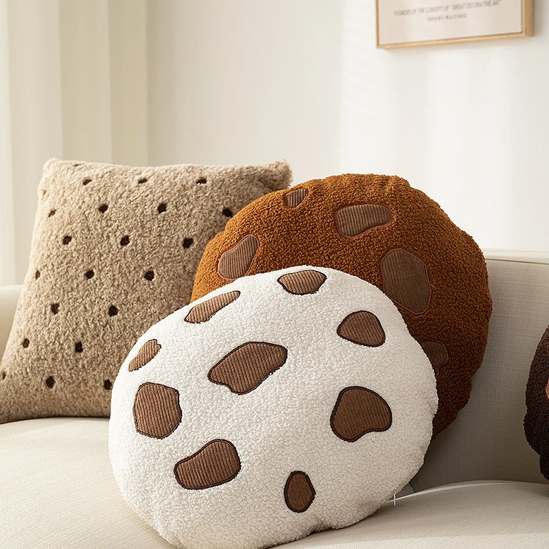 Round cuddle seat cushion with teddy fleece and abstract patch appliqués Stornfield