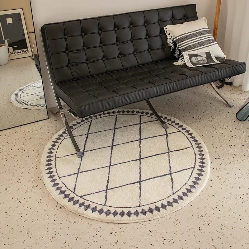 Round living room rug with graphic diamond pattern and soft short pile Stornfield