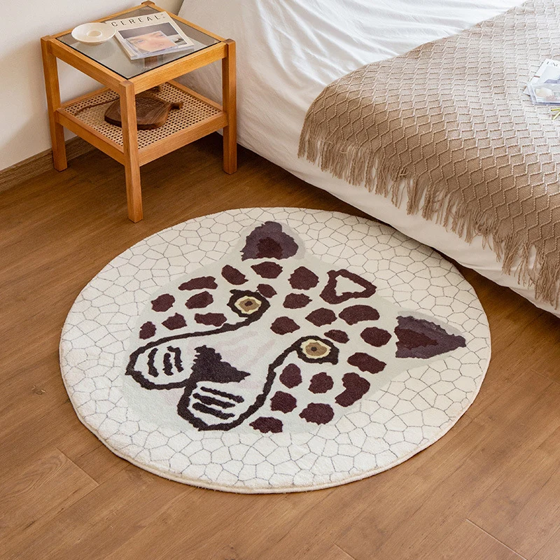 Round living room rug with graphic diamond pattern and soft short pile Stornfield
