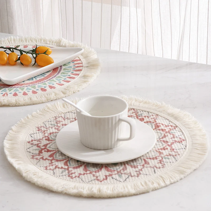 Round flat-woven cotton rug with mandala design and decorative fringes Stornfield