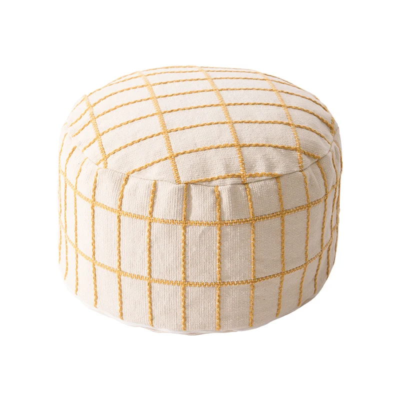 Round seat pouf with knitted check cover and shape-stable inner core Stornfield