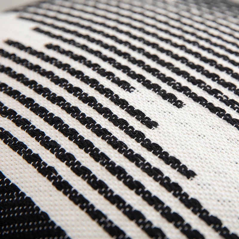 Rectangular Jacquard lumbar cushion cover with geometric ethnic relief and decorative tassels Stornfield