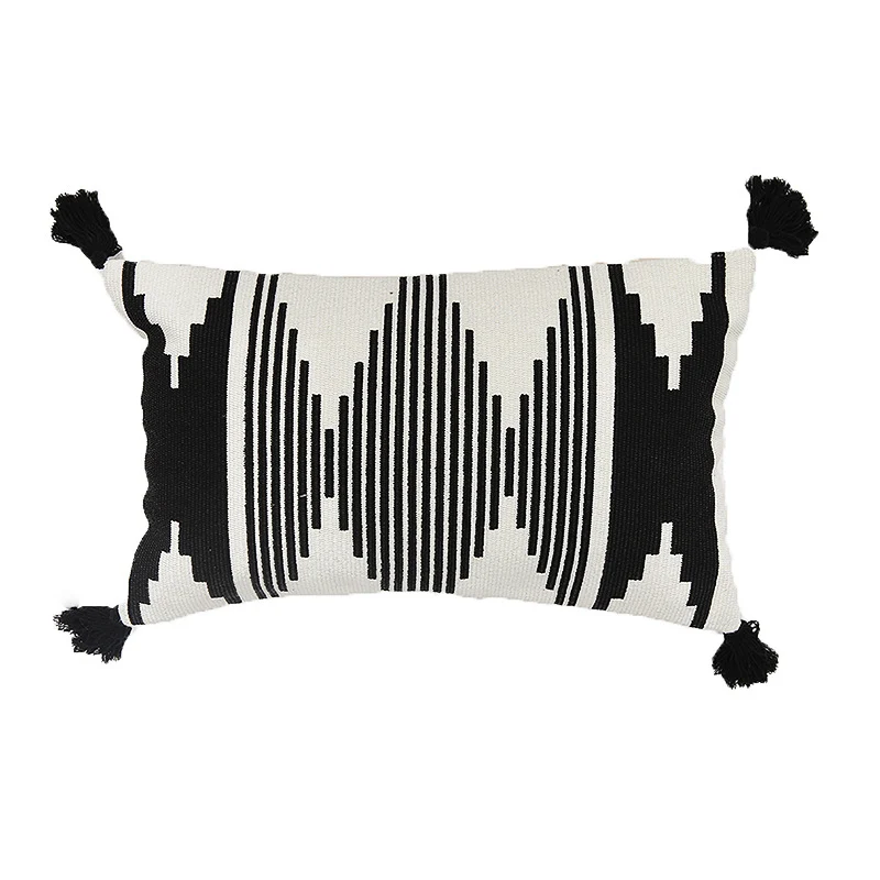 Rectangular Jacquard lumbar cushion cover with geometric ethnic relief and decorative tassels Stornfield