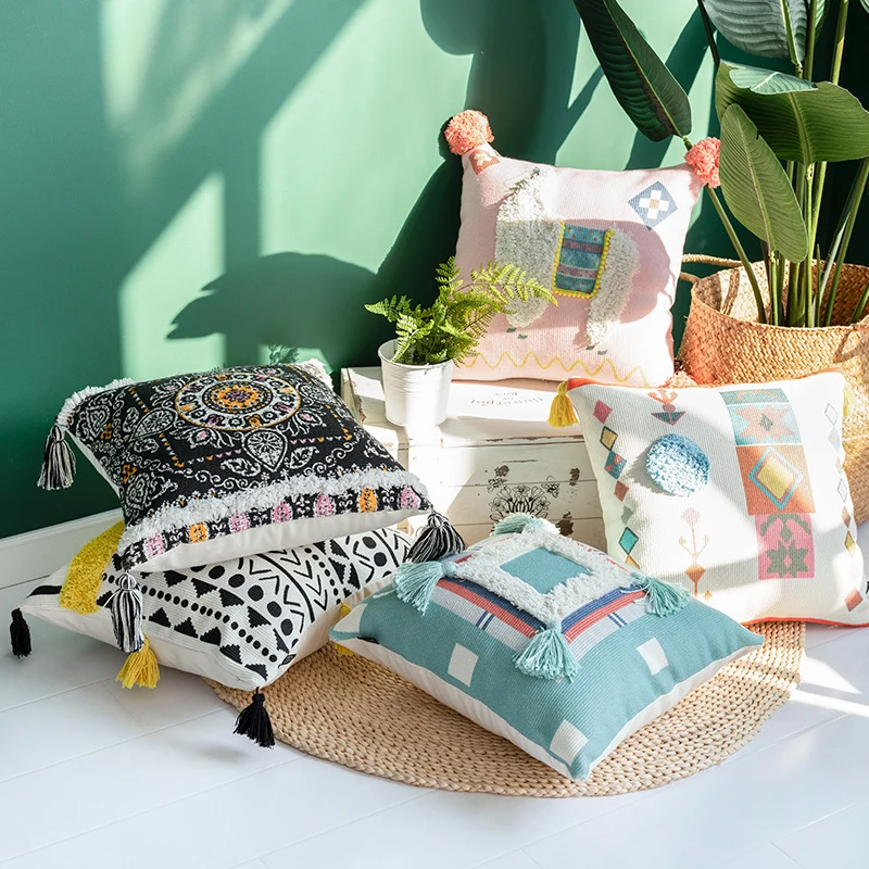 Square cushion cover with 3D alpaca appliqué, bouclé patch and pom-pom corners Stornfield