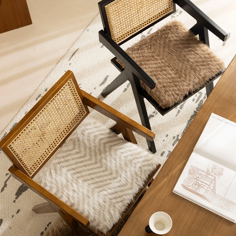 Square chair cushion made of cozy artificial fur with non-slip base and strap attachment Stornfield