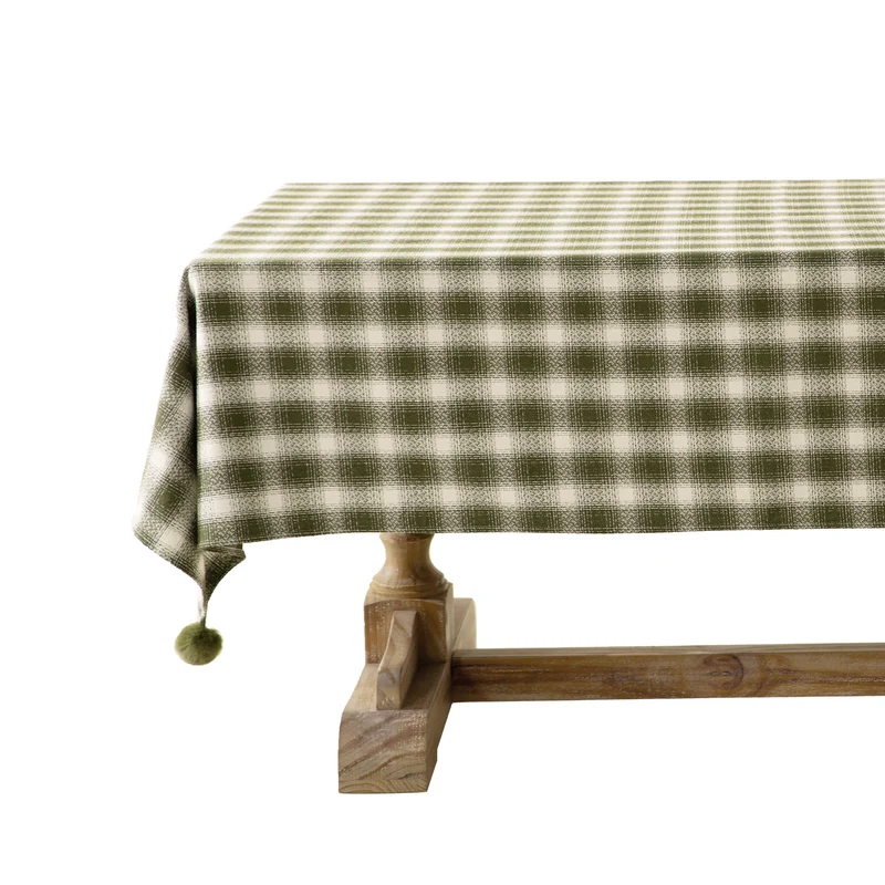Square tablecloth made of cotton blend fabric with checkered weave pattern and pom-pom corners Stornfield
