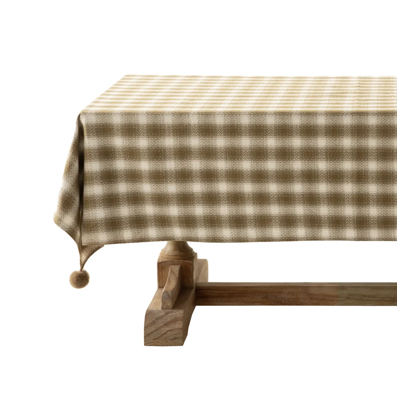 Square tablecloth made of cotton blend fabric with checkered weave pattern and pom-pom corners Stornfield