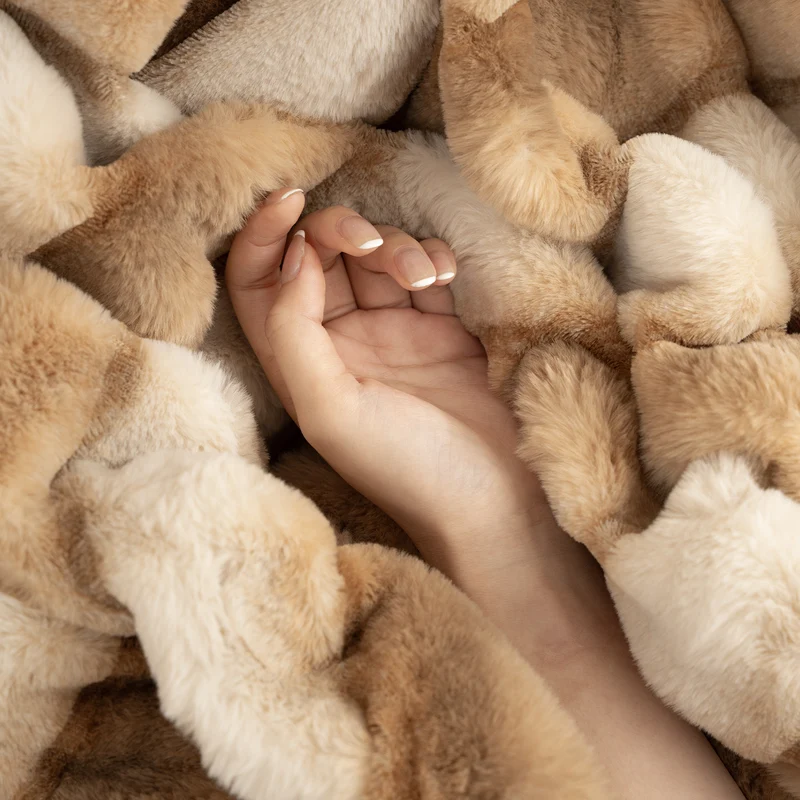 Luxurious cozy faux fur blanket with quilted relief pattern Stornfield