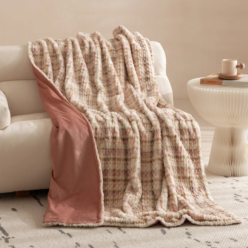 Cozy blanket made of luxurious synthetic fur with wavy texture and soft microfiber back Stornfield