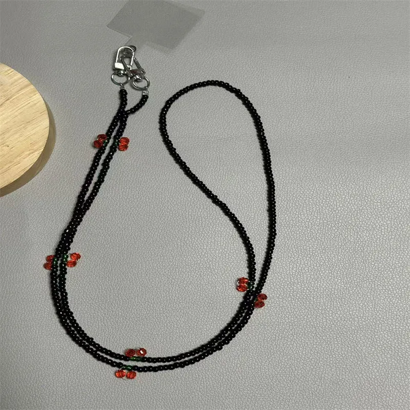 Perlen-Brillenband mit künstlerischen Charms Karnz