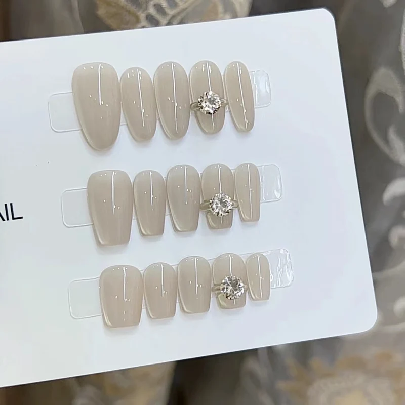 Elegant Press-On Nail Art with Jewel Accents Stornfield