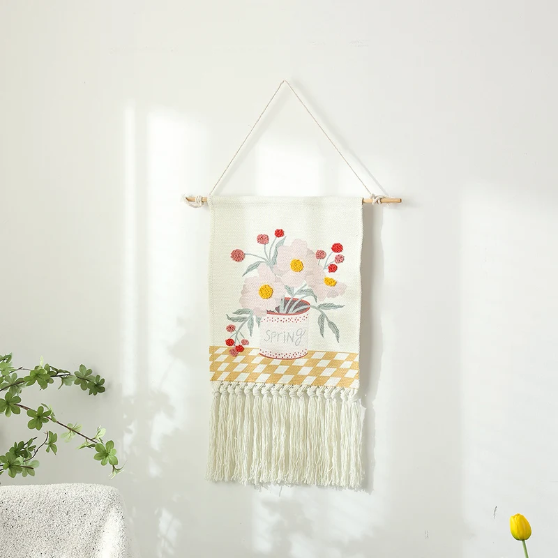 Woven cotton wall hanging with punch needle flower relief and fringes Stornfield