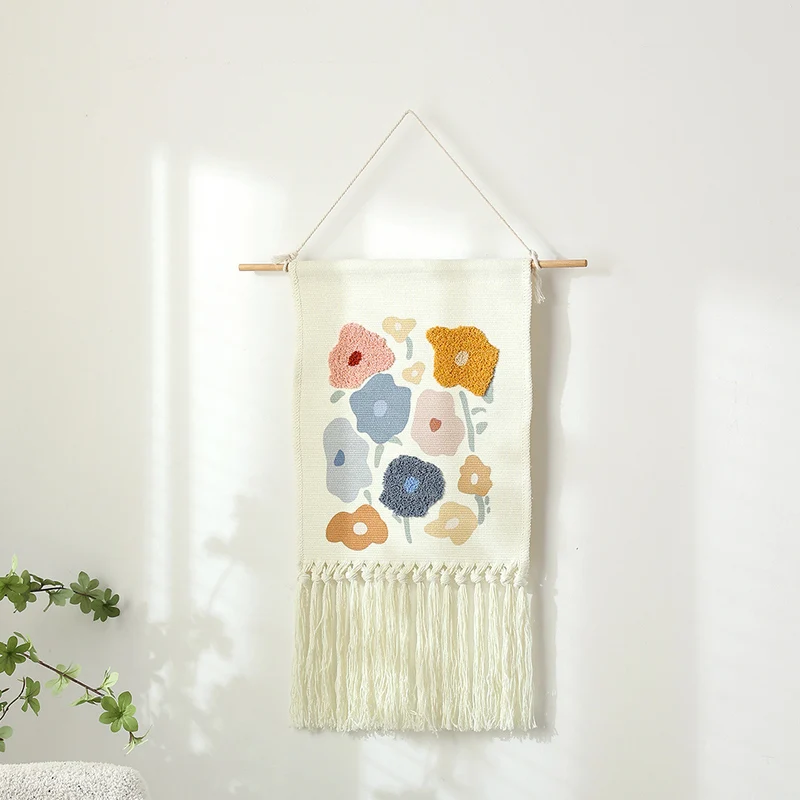 Woven cotton wall hanging with punch needle flower relief and fringes Stornfield