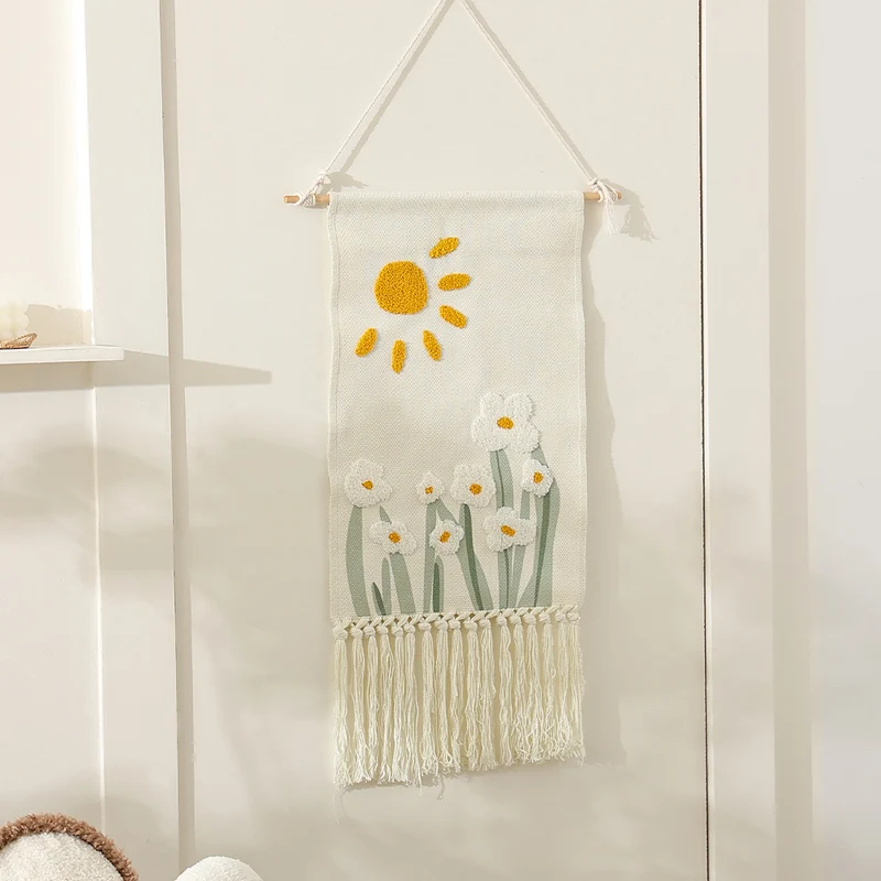 Woven cotton wall hanging with punch needle flower relief and fringes Stornfield